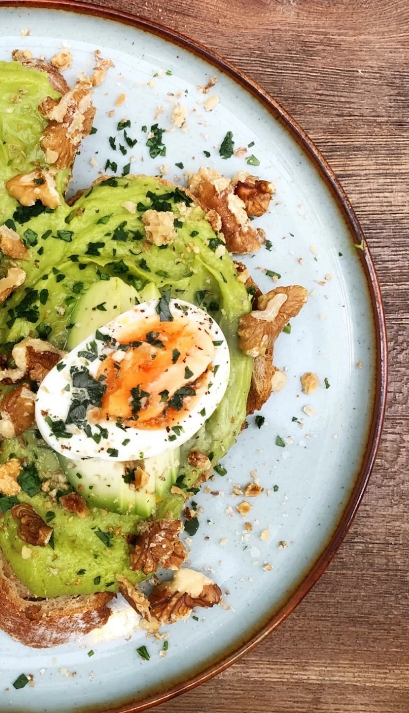 Smashed avocado toast with a poached egg